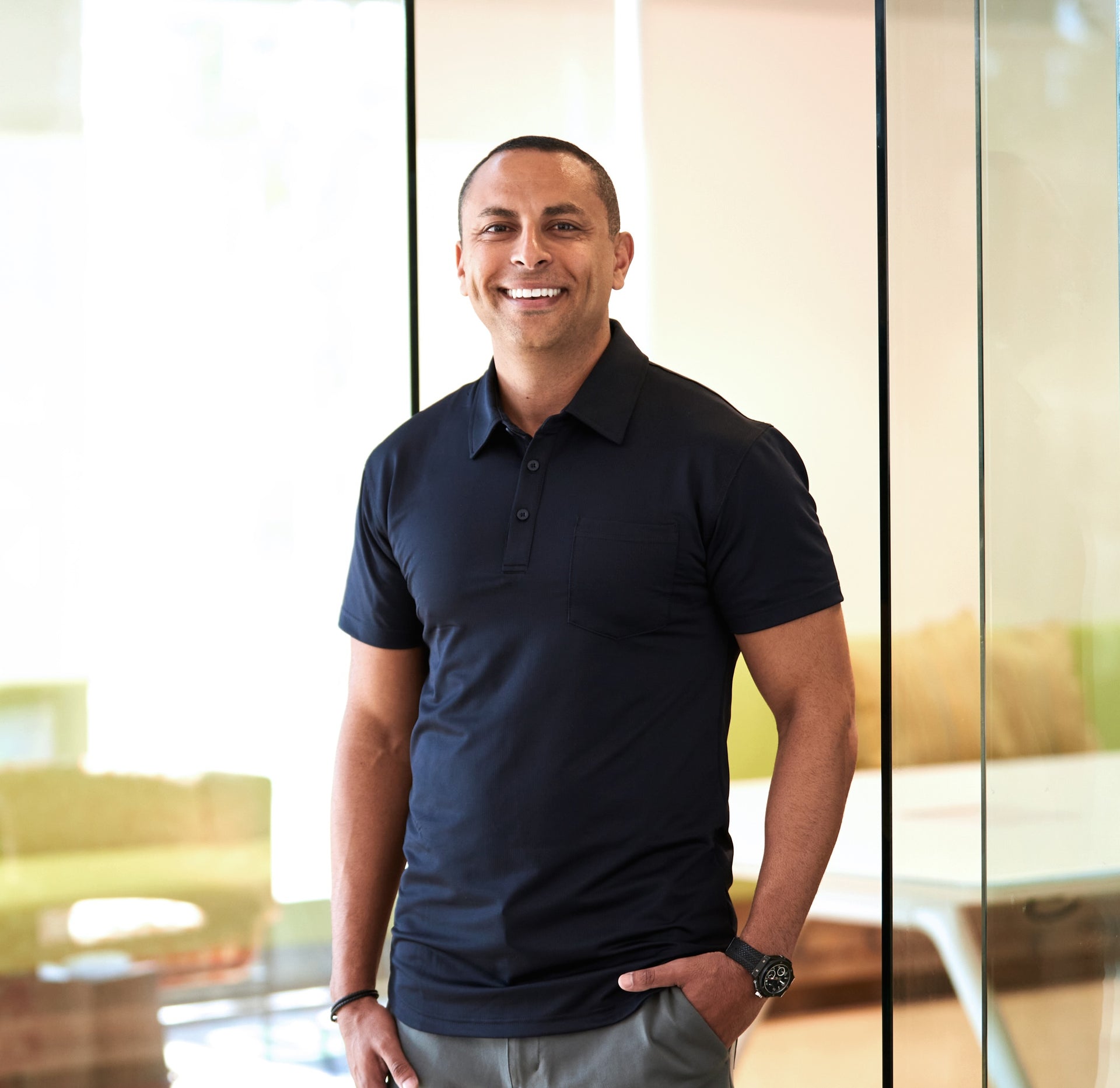 Portrait Photo of andrew abraham wearing a navy polo shirt