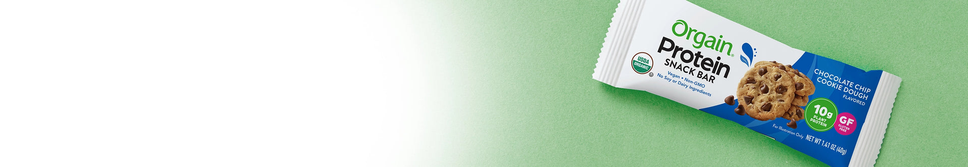 organic chocolate chip cookie dough protein bar on a green background