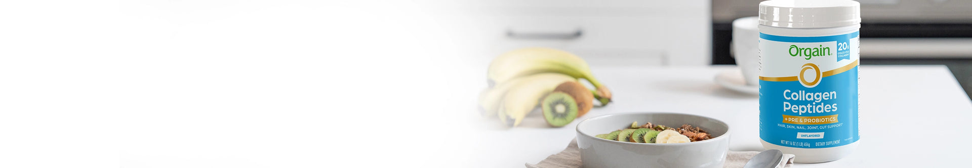 collagen peptides plus probiotics on a table next to a bowl of fruit