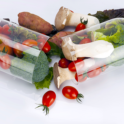 fresh vegetables falling out of a plastic capsule