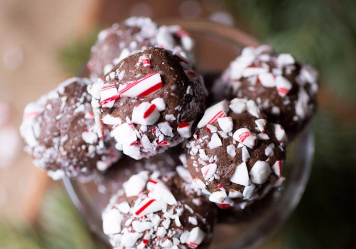 A bouquet of peppermint hot cocoa cake pops in a jar.