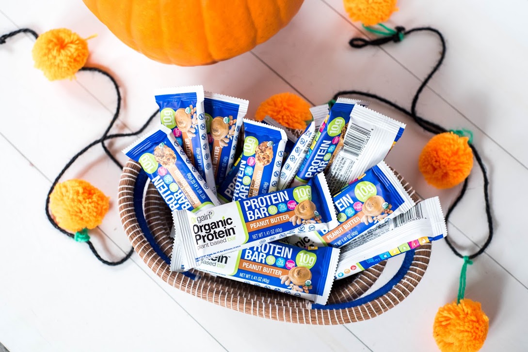 A bowl of Orgain's Organic Protein Bars sitting amongst colorful autumn decor.