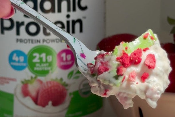a spoon with strawberry matcha topper