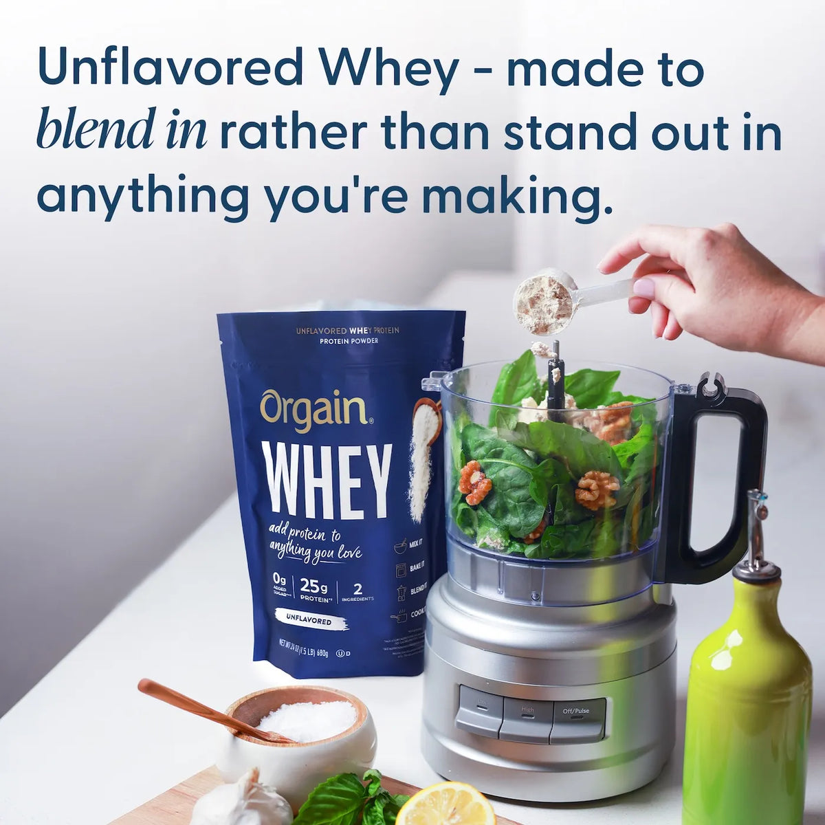 Orgain unflavored whey being scooped into a blender with label highlighting how easy it blends.