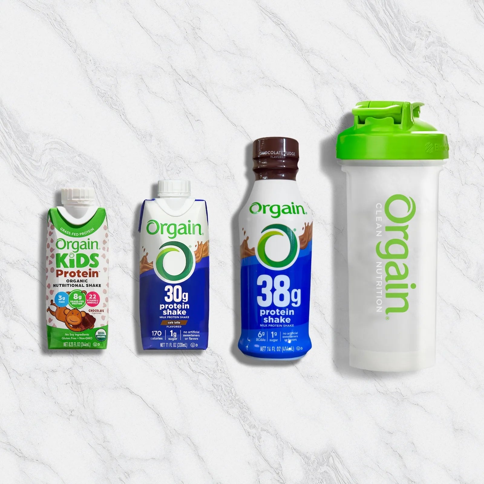 Collection of Orgain protein products including a bottle, a container, and a shaker on a white background