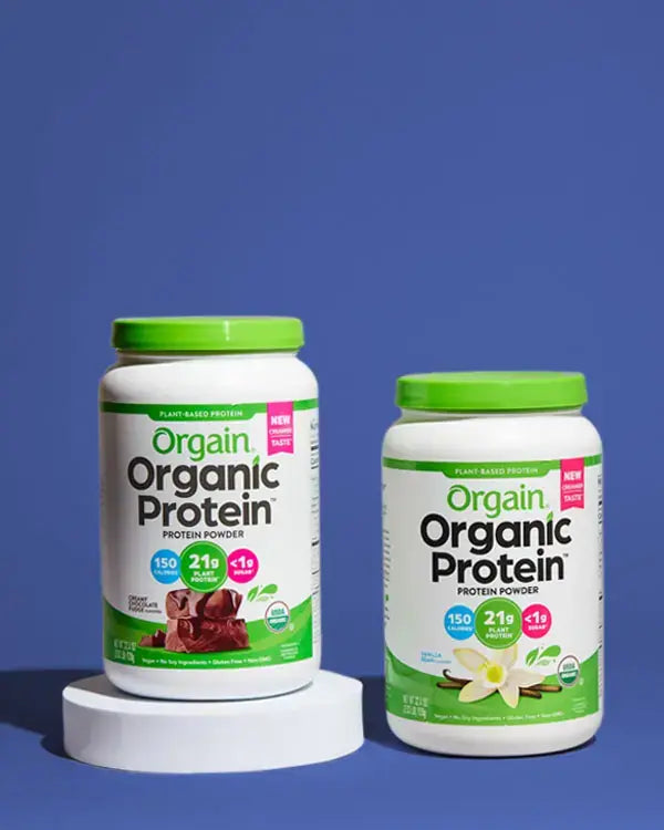 Vanilla and Chocolate Vegan Protein Powder containers standing next to eachother