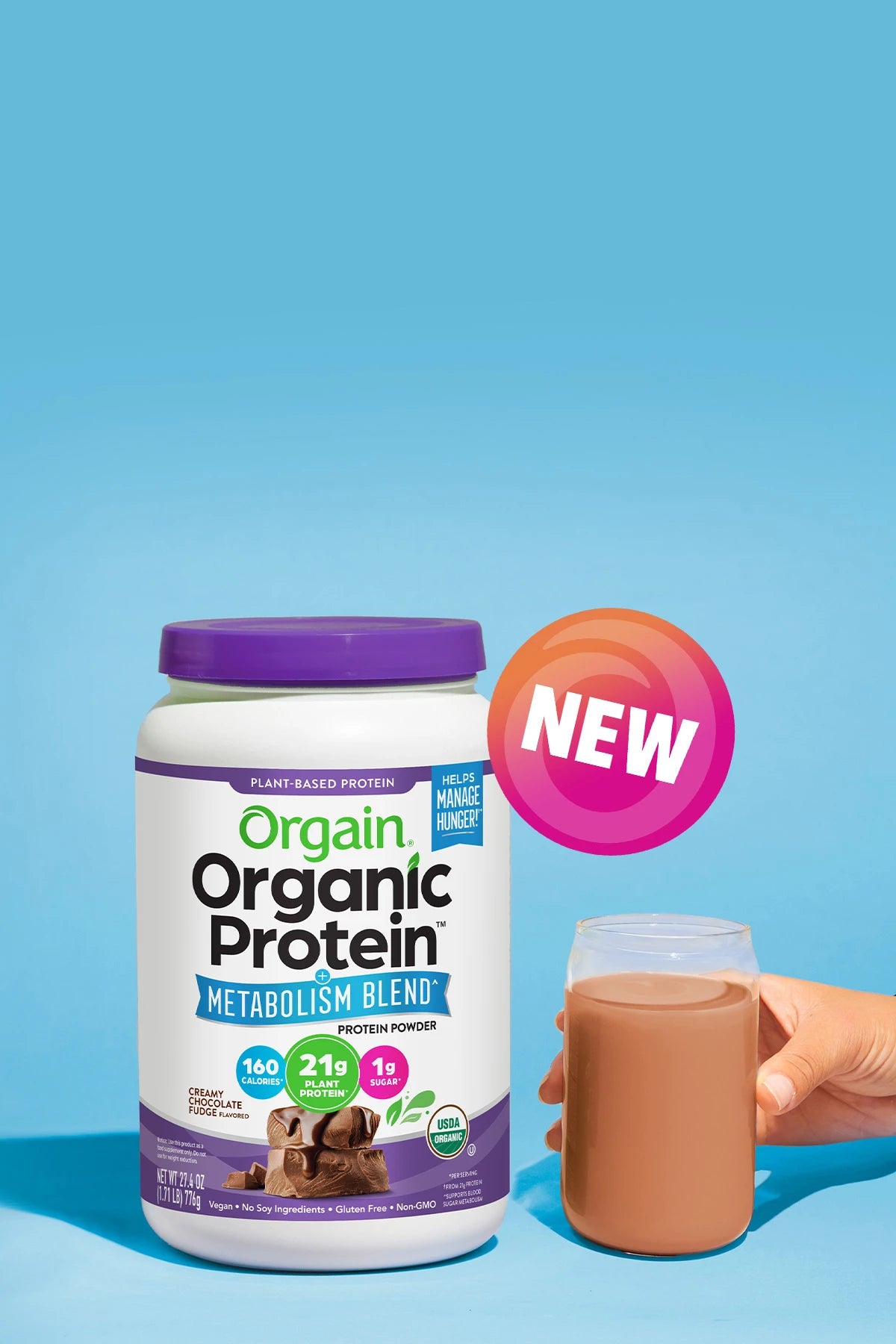 Orgain Organic Protein Metabolism Blend container with a glass of protein shake on a blue background