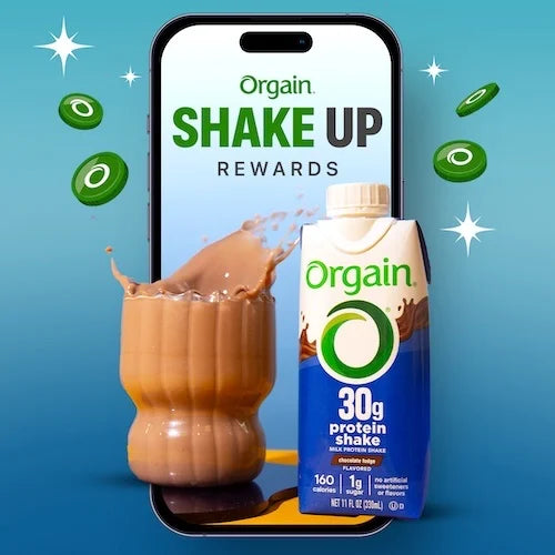 Orgain protein shake with smartphone displaying 'Shake Up Rewards' on a blue background