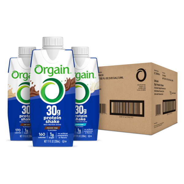 Orgain protein shake cartons with a cardboard box in the background